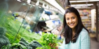 31375074 - young woman choosing leafy vegetables