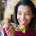 45334789 - woman eating fresh salad
