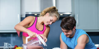 52031489 - couple making smoothie